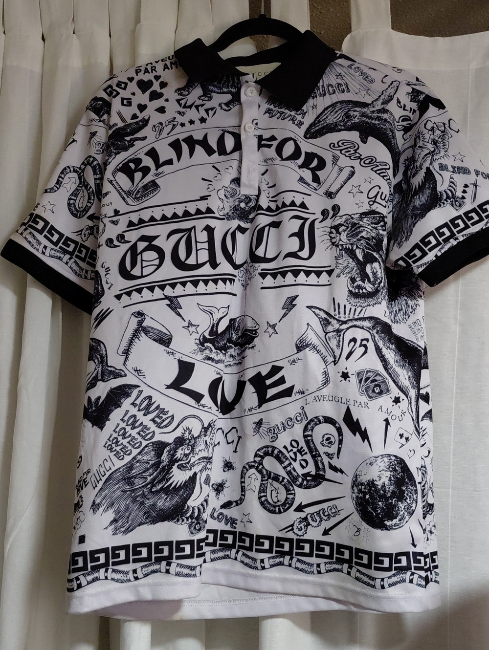 Gucci White Polo with "Blind For Love" Black Graphic Print